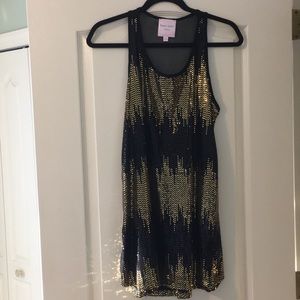 Black and gold sequin dress